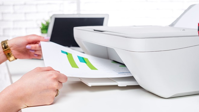 printout being removed from printer tray